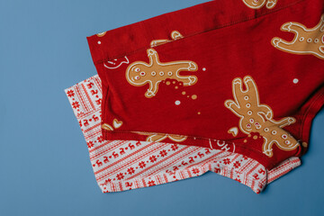 a pair of red panties decorated with New Year's drawings on a blue background