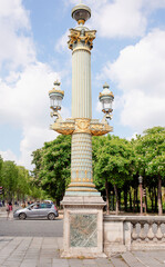  Rostral column with lanterns on the Place de la Concorde. By area moving pedestrians and cars