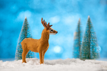 Toy deer made on christmas winter background