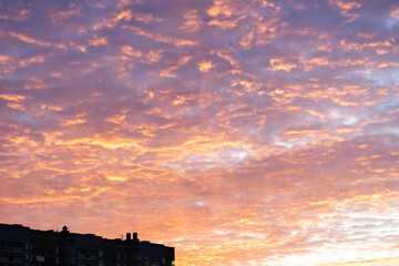 sky, colorful bright crimson dawn sunrise over the city, beautiful view of the dawn sky, orange yellow blue sky color