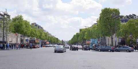  Champs Elysees. On the roadway moving cars, pedestrians-on sidewalks
