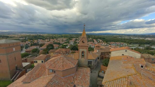 Drone Flying Above Roofs Towards The Church Of San Cristoforo (Bettolle) In Sinalunga, Italy - aerial, fpv