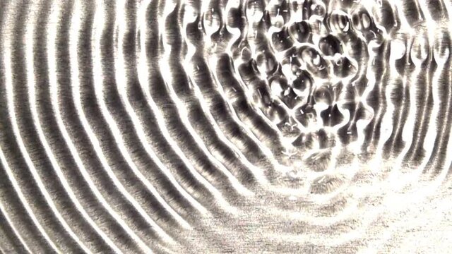 A concentric wave-train grows in complexity.