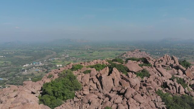 Interesting orange rock covered mountain close to Tindivanam Highway in India