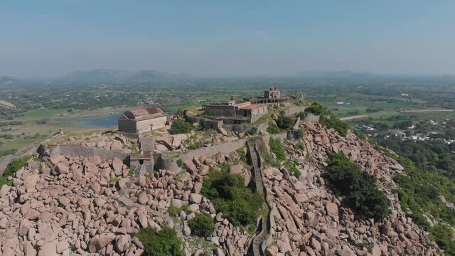 Krishnagiri fort standing alone on a mountain top overlooking beautifuil landscape bellow, India