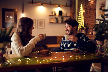 Couple spending time together in cafe during Christmas