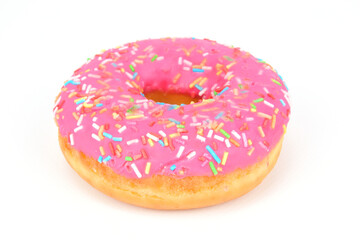 Donut covered with raspberry glaze and caramel sprinkles on a white background