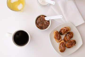 Homemade bread toast with a delicious homemade apple and onion chutney, with cinnamon on a light white board. Perfect jam for breakfast. Breakfast, cooking, food concept.