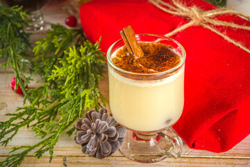 Set of different Christmas and winter drinks. An assortment of Christmas cocktails, hot and cold beverages, in cozy wooden home background with Xmas decor