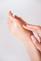 Young woman uses a scrub for skin care. Self-care, relaxation