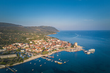 Obraz premium Aerial drone view of iconic medieval seaside town of Ouranoupolis featuring famous tower, Halkidiki, North Greece