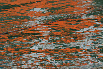 Reflection of oranje spots in the water