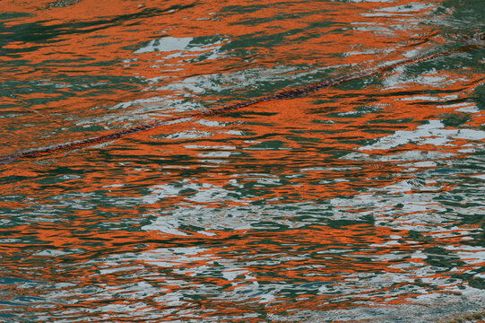 Reflection of oranje spots in the water