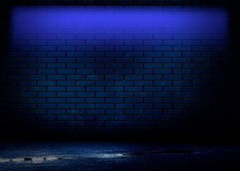 Dark brick wall, blue neon light. Rays and glare of light in the dark. Night view of a dark street, abstract projection on an empty wall.