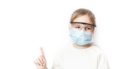 Coronavirus protection. The face of a child in a mask and glasses. A little preschool girl observes prevention of covid 19. Stay at home. keep social distance. Children's health and viruses. 