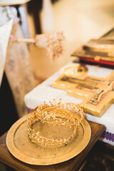 Golden crowns lying on the table in church