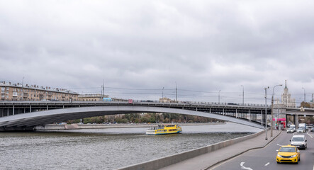  Along the streets moving pedestrians and vehicles