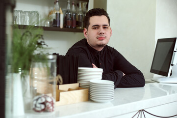 Bartender in a working environment in the cafeteria