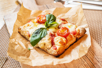 slice of italian pizza in the pizzeria