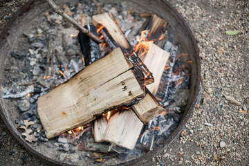 firewood burning in fire pit