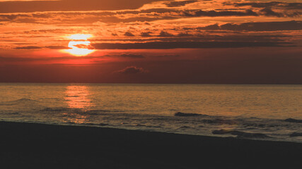 Fototapeta na wymiar Sunset on the Baltic Sea on the beach in Krynica Morska