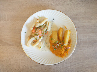 Blanquette d'encornets, purée de patates douces et panais