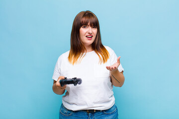 plus size woman looking angry, annoyed and frustrated screaming wtf or what’s wrong with you