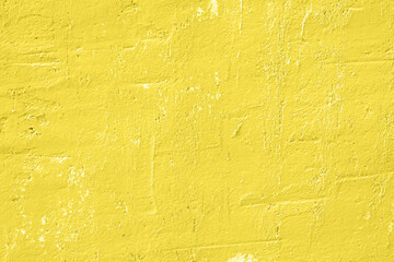 Fototapeta premium Concrete yellow colorful wall surface texture. Abstract grunge bright illuminating color background with aging effect. Copyspace.