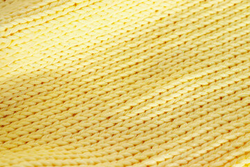 knitting yellow background with space for text.the concept of knitting.