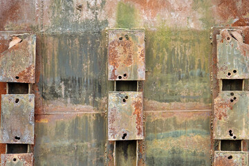Old Rusty Green Background. Damaged Aged Box With Rust And Peeled Paint. Worn Wall Material. Old Eroded And Corroded Cargo Container.