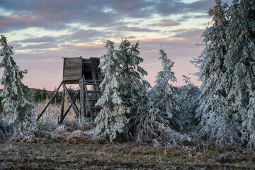 Winter landscape with a deerstand