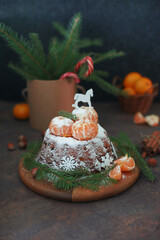 A tangerine cupcake is on the table