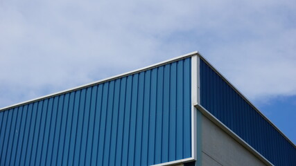 warehouse roof facade against sky background