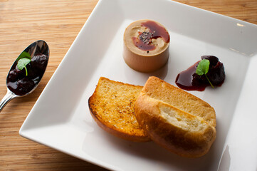 Pate or foie gras. Classic French bistro appetizer delicacy, served with a toasted buttery baguette.