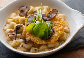 Gnocchi. Pasta sautéed with truffles garlic, onions, olive oil and fresh herbs and spices. Classic American steakhouse or French bistro appetizer or side dish.