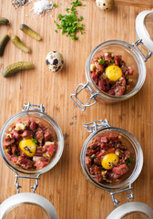 Steak tartare. Classic American restaurant or French bistro appetizer classic. Steak diced, mixed with eggs, red onions, olive oil, lemon juice, garlic and capers. Served with garlic bread.