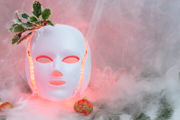 Led mask glowing blue with christmas ball