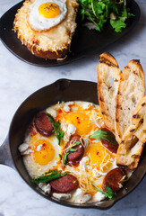 Eggs and chorizo frittata or omelette. Chorizo, salt, pepper, scallions, parsley, cheese with parsley and avocado slices. Classic American, French or Italian restaurant breakfast or brunch favorite.