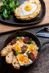 Eggs and chorizo frittata or omelette. Chorizo, salt, pepper, scallions, parsley, cheese with parsley and avocado slices. Classic American, French or Italian restaurant breakfast or brunch favorite.