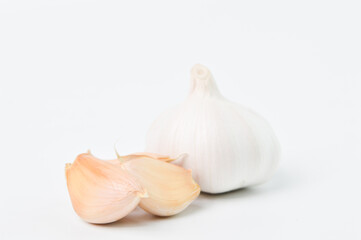 Fresh garlic isolated on white background. Selective focus.