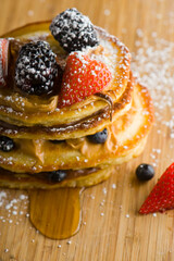 Pancakes. Homemade Pancakes with crispy Bacon, butter and maple syrup. Classic American breakfast or brunch favorite. Made from scratch Cakes with bacon, butter and maple syrup.