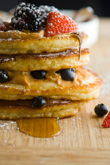 Pancakes. Homemade Pancakes with crispy Bacon, butter and maple syrup. Classic American breakfast or brunch favorite. Made from scratch Cakes with bacon, butter and maple syrup.