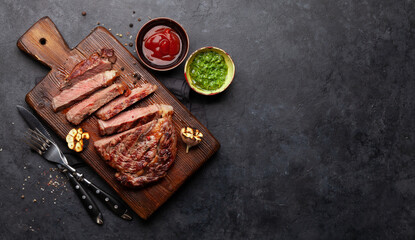 Sliced beef steak with sauces