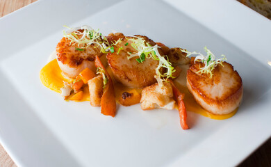 Scallops. Sautéed scallops seared in butter, garlic, shallots, red wine, tarragon, salt and pepper and served with toasted baguettes. Classic French bistro entree.