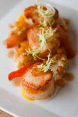 Scallops. Sautéed scallops seared in butter, garlic, shallots, red wine, tarragon, salt and pepper and served with toasted baguettes. Classic French bistro entree.
