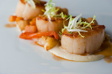 Scallops. Sautéed scallops seared in butter, garlic, shallots, red wine, tarragon, salt and pepper and served with toasted baguettes. Classic French bistro entree.