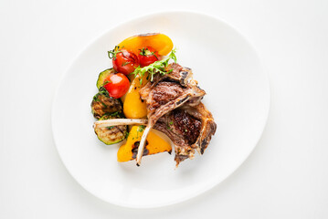 Modern French cuisine: Roasted Lamb neck & rack served with carrot, yellow curry and lamb sauce.