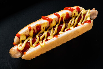 hot dog on the black background