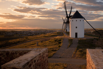 Exterior view of windmills on landscape in spring at sunset in Alcazar de San Juan, Ciudad Real,...