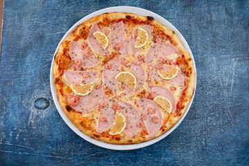fresh pizza on the white plate